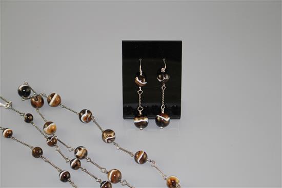 A white metal and graduated banded agate bead long necklace and pair of matching earrings, necklace 130cm, earrings 55mm.